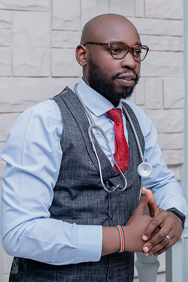 Male African doctor in spectacles with a stethoscope